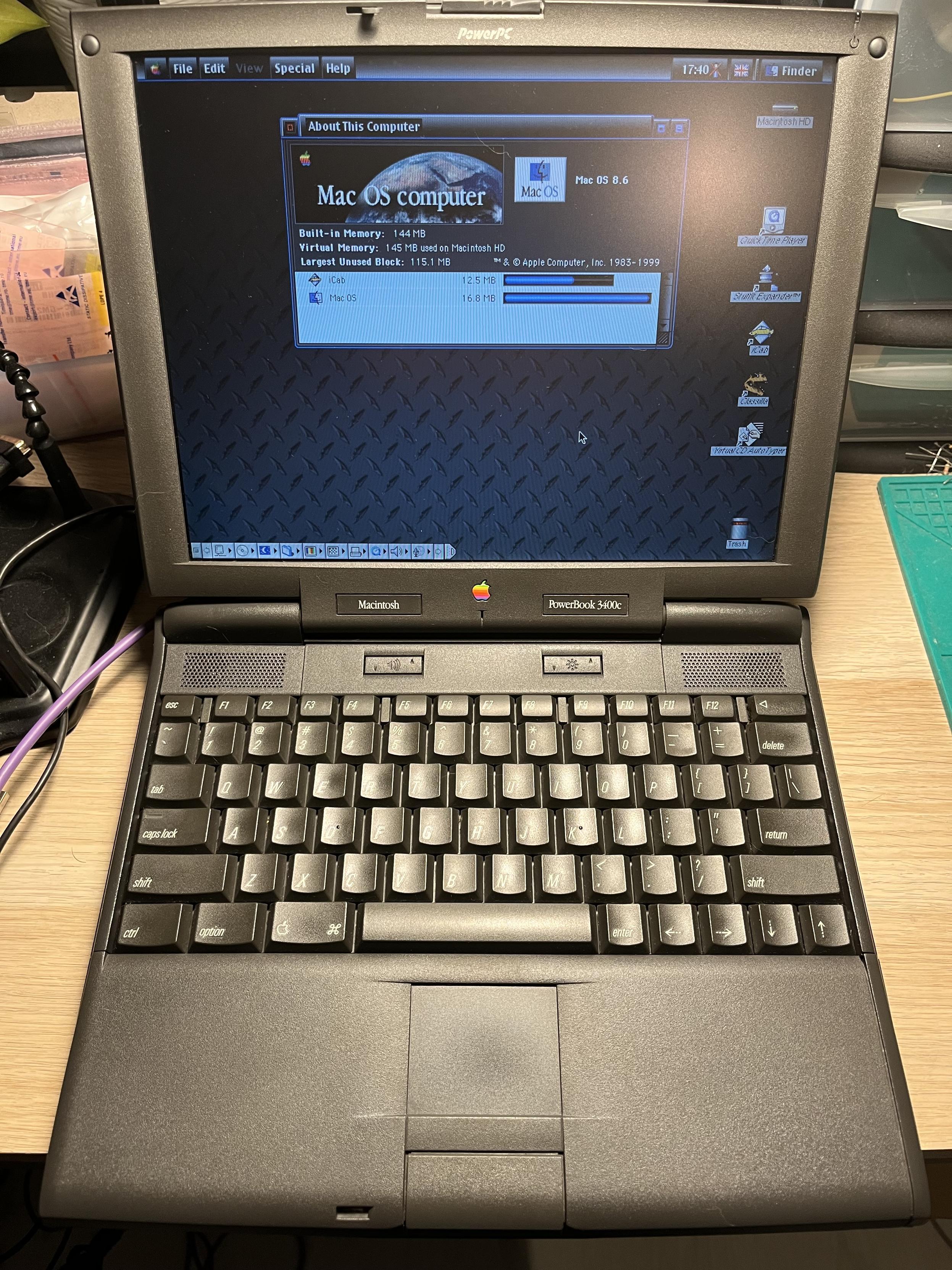 A slightly shiny PowerBook 3400c, running Mac OS 8.6. System theme changed to HiTech and oh, it's awful.
